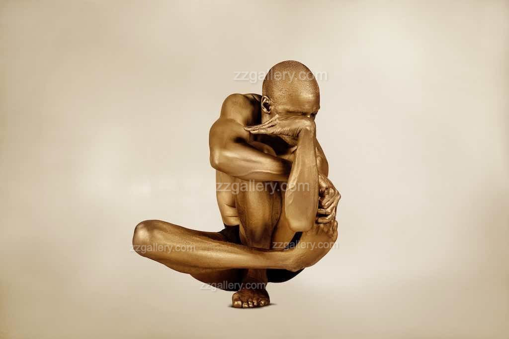 Golden yoga figure fine art photograph in meditative pose, luxury wall art for collectors and wellness interiors