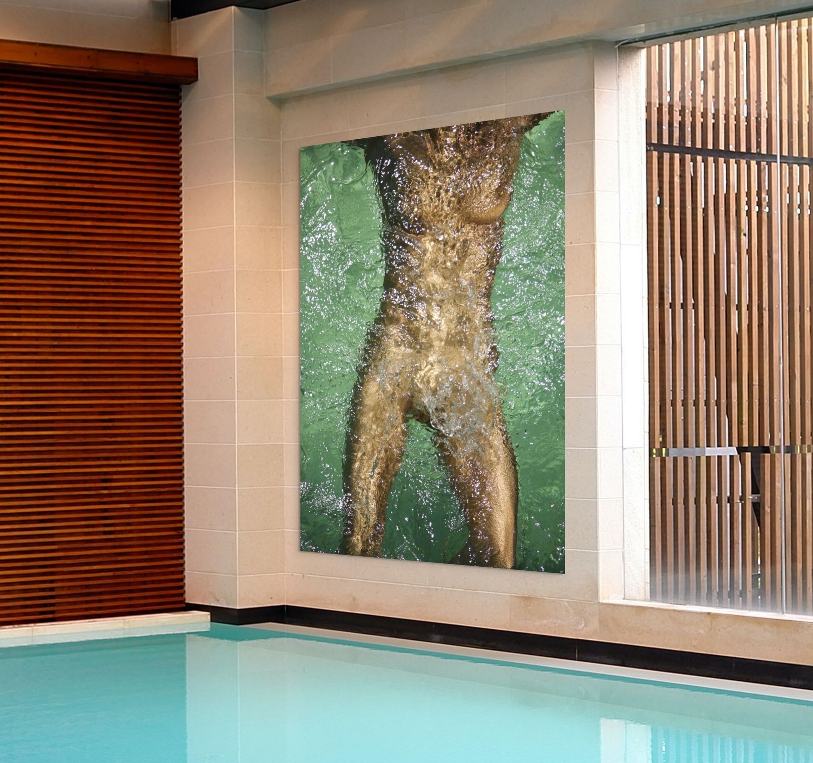 Golden-painted figure body captured underwater in fine art photography, shimmering through flowing water in a swimming pool, symbolizing purity, renewal, and transformation.