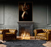 Golden fine art photograph of a sculptural silhouette painted in shimmering gold and silver tones, displayed above a black marble fireplace in a luxury interior.