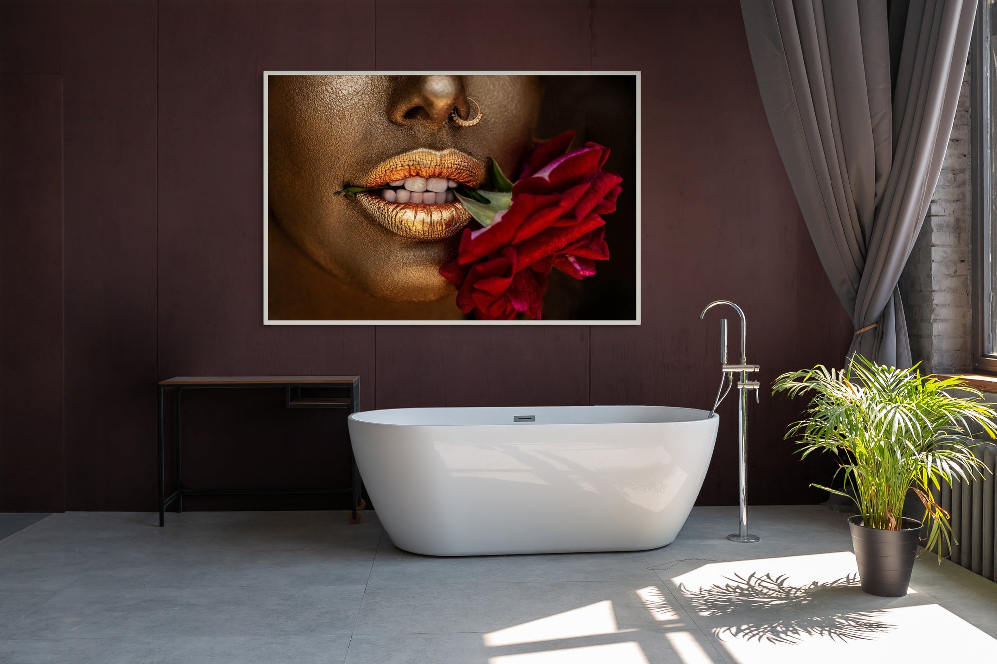 Close-up fine art photograph of golden-painted lips gently biting a red rose, symbolizing sensuality and passion, perfect as luxury wall art for modern interiors, spas, or collectors.