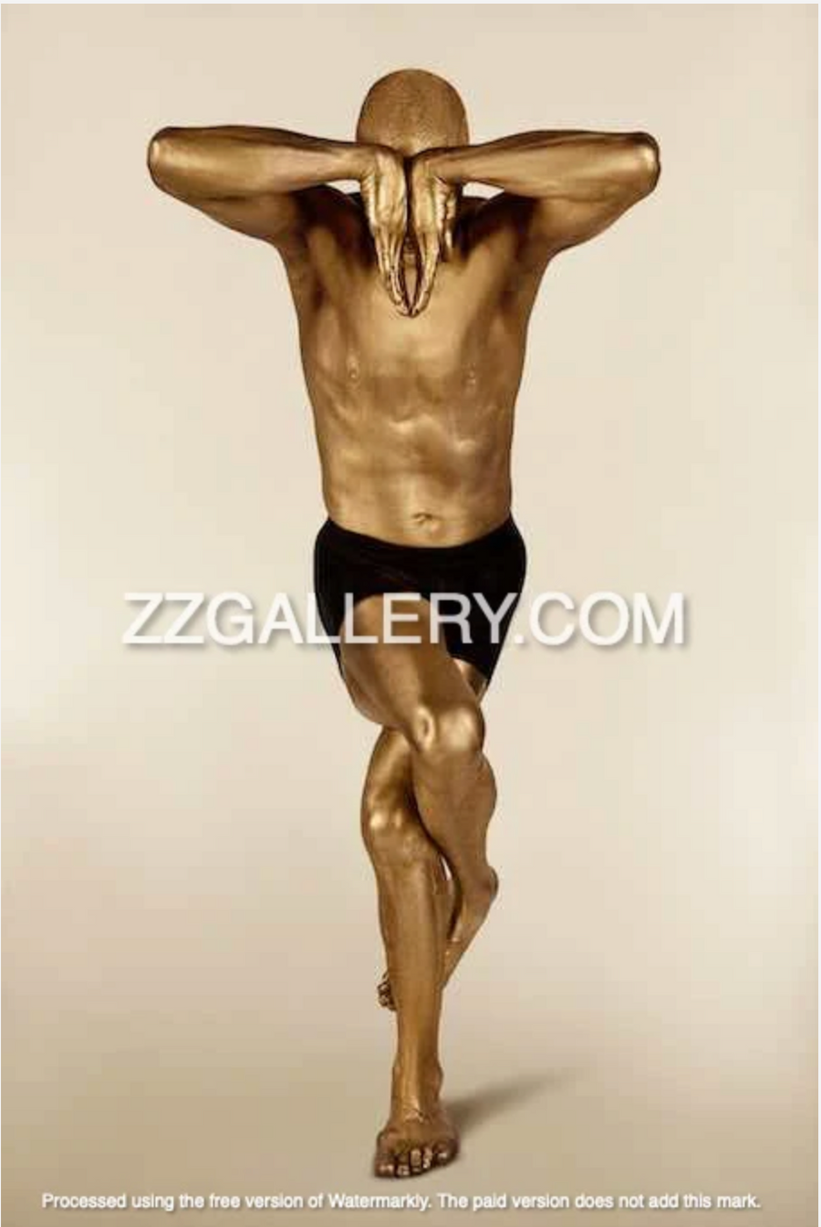 Golden-painted male figure in an elegant yoga balance pose, fine art photography displayed in a Japanese zen-style interior with bonsai and low tea table, perfect for wellness and meditation spaces.