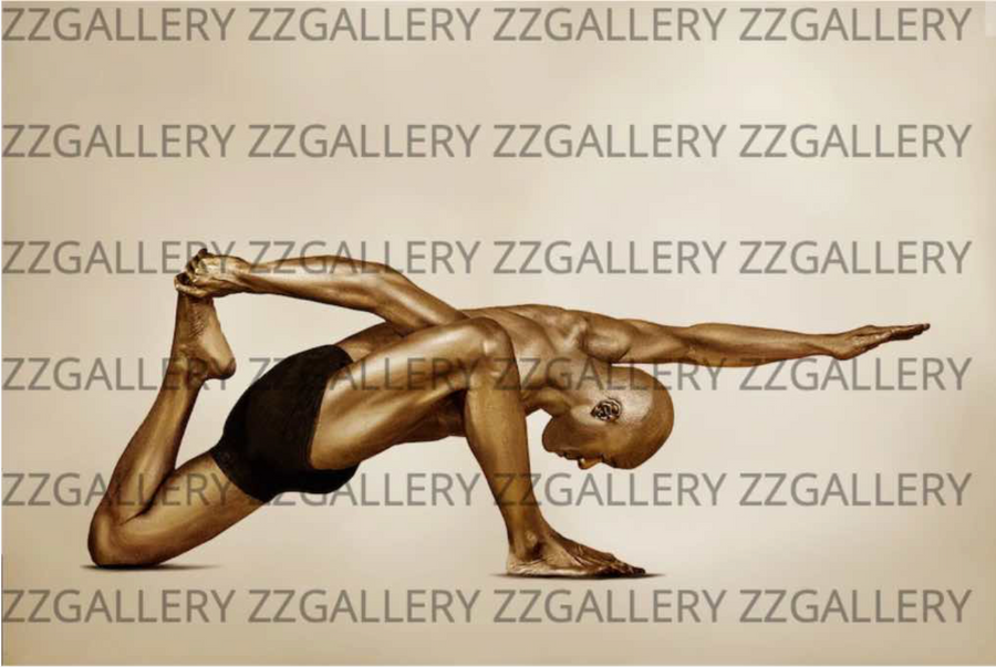 Golden-painted male figure in a powerful yoga balance pose by Zack Zublena, with one arm extended forward and the other gripping the foot, symbolizing strength, focus, and body-mind harmony.
