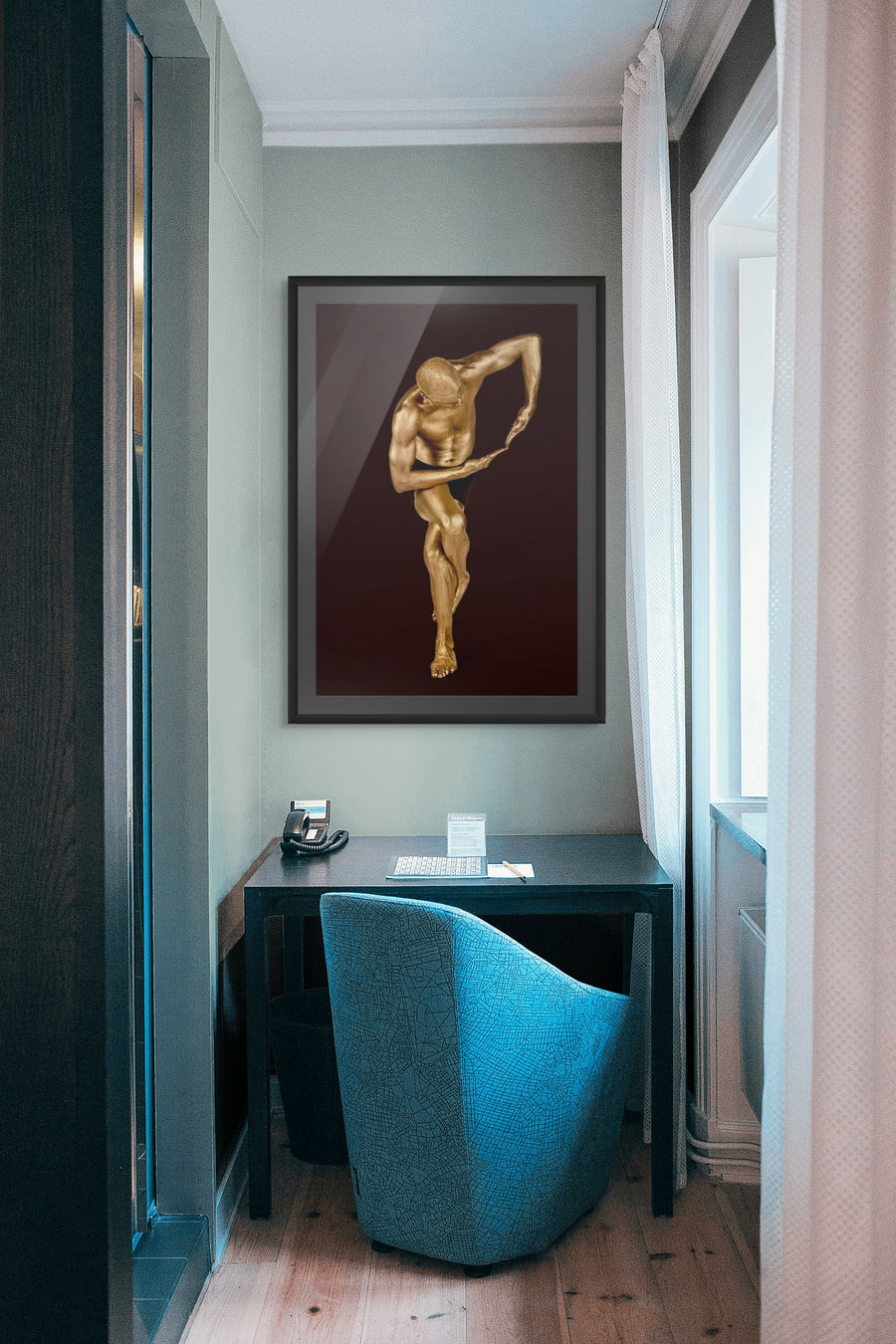 Golden male figure in a sculptural standing pose with arm curved inward – luxury fine art photography for modern interiors, spas, hotels, and collectors.

