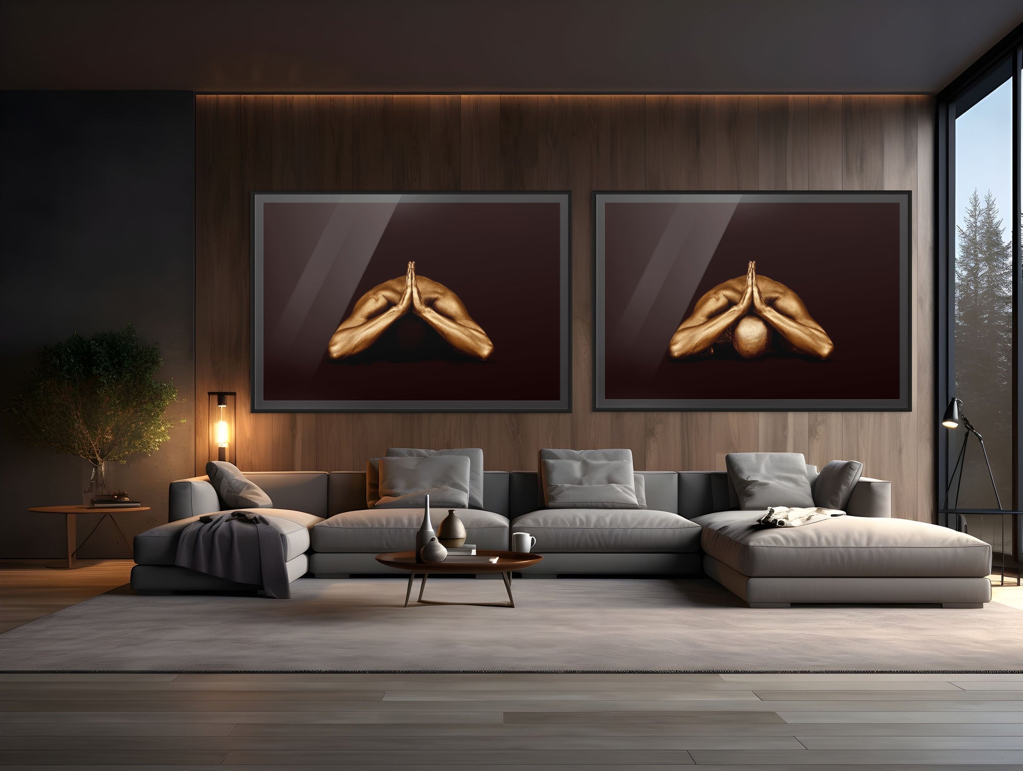 Two framed fine art photographs of a golden-painted male figure in a yoga pose with folded hands, displayed side by side in a modern living room with wood-paneled walls and a sectional sofa.