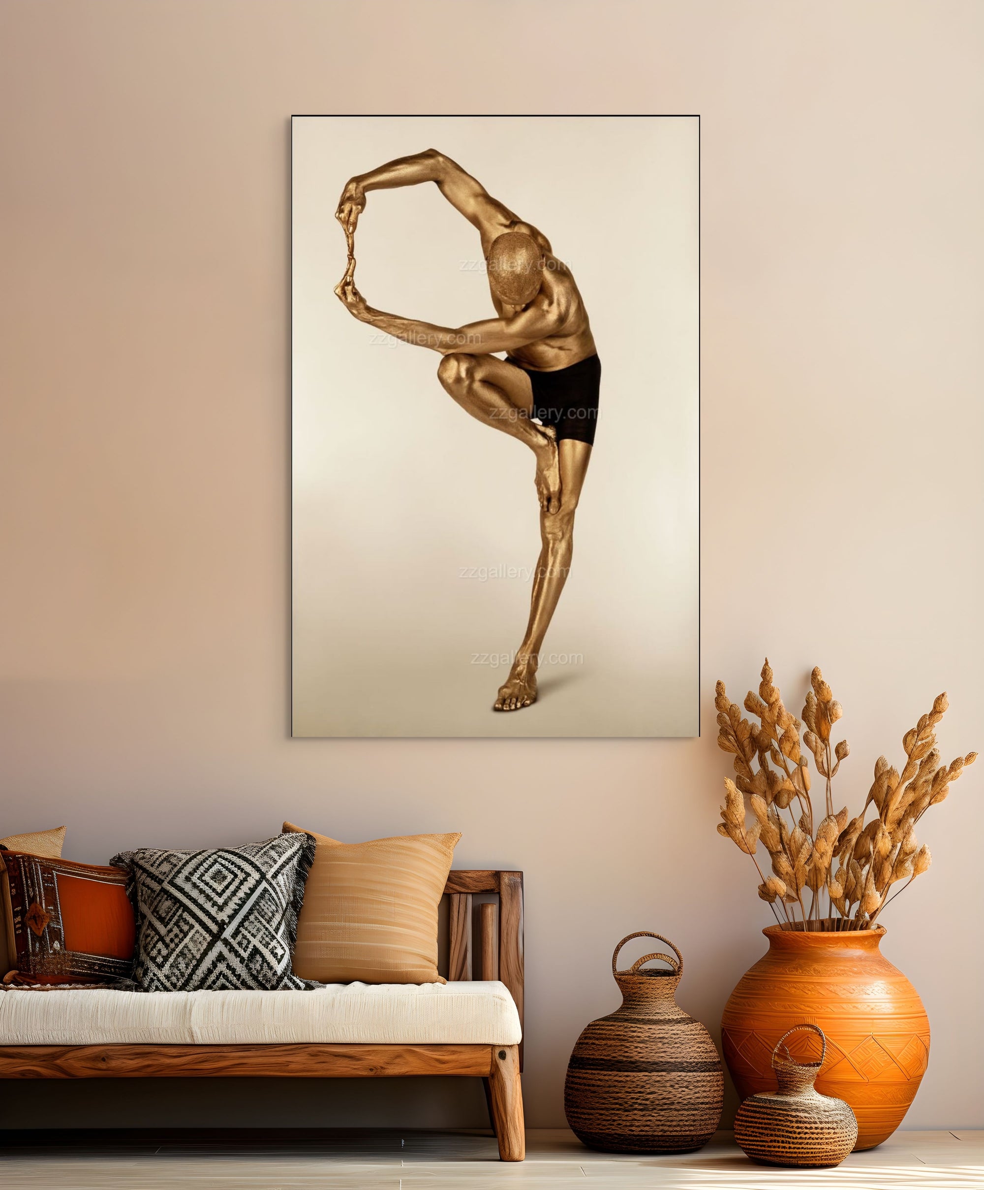 Golden-painted male figure in an advanced yoga pose, balancing on one leg with arms extended. Fine art photography by Zack Zublena highlighting strength, flexibility, and focus.