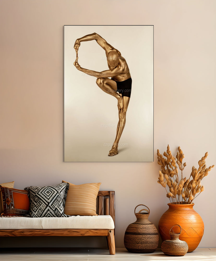 Golden-painted male figure in an advanced yoga pose, balancing on one leg with arms extended. Fine art photography by Zack Zublena highlighting strength, flexibility, and focus.