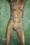 Golden painted nude body immersed in water, fine art photography capturing sensuality, fluid motion, and contemporary luxury wall art.