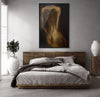 Elegant bedroom with a large framed artwork of a golden-painted female back. Sensual nude photography print radiating warmth and sophistication.