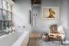 Golden nude woman fine art photograph by Zack Zublena displayed in a modern bathroom, blending luxury, serenity, and contemporary wall decor.