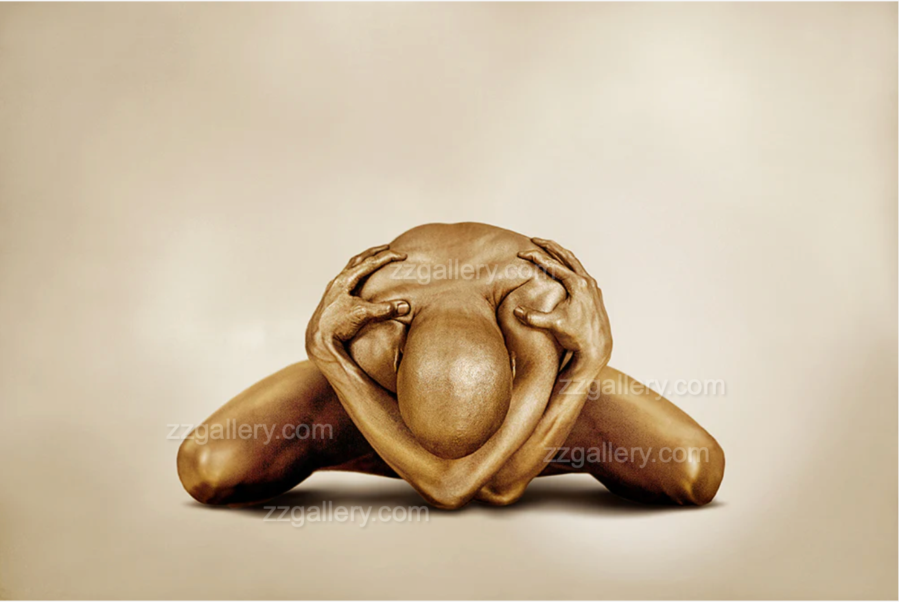 Golden nude male figure folded forward in emotional surrender, gripping head – sculptural fine art wall photography