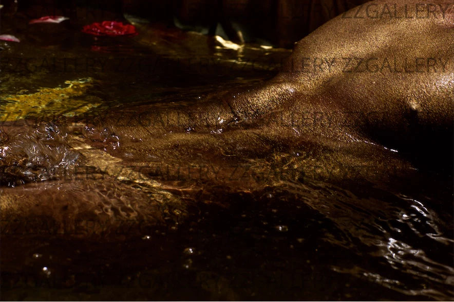 Golden nude male torso in water with muscular detail, sensual erotic fine art photography for gay collectors, spas, and luxury wall decor.