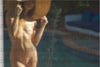 Golden nude abstract photography near a pool, feminine fine art reflection with golden tones, luxury wall decor for spas, hotels, and collectors.