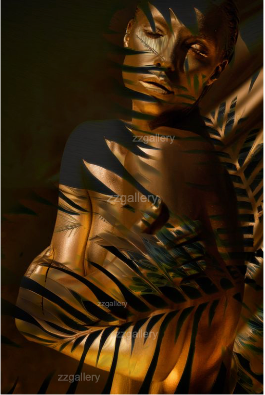 Golden-painted nude woman with fern shadows – Jungle Goddess fine art print by Zack Zublena
