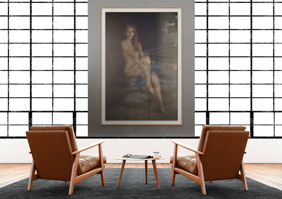 Golden Reflection fine art photography displayed above a modern bedroom bed, featuring a golden-painted abstract feminine figure blurred through glass for an ethereal, atmospheric effect.