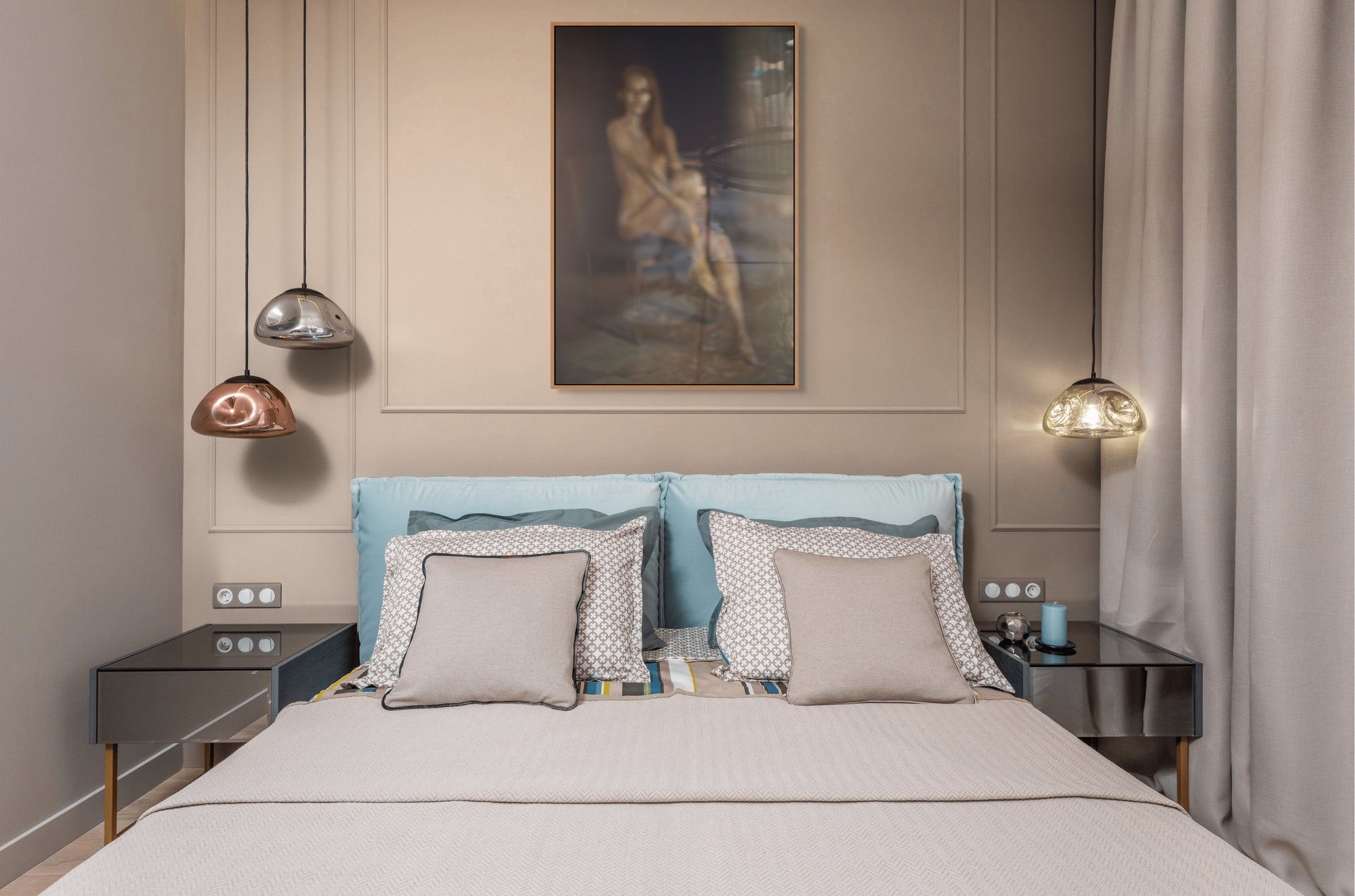 Golden Reflection fine art photography displayed above a modern bedroom bed, featuring a golden-painted abstract figure blurred through glass for an ethereal, dreamlike effect.