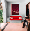 Elegant red interior with luxury wall decor featuring surreal golden artwork of roses, creating a bold and modern fine art atmosphere