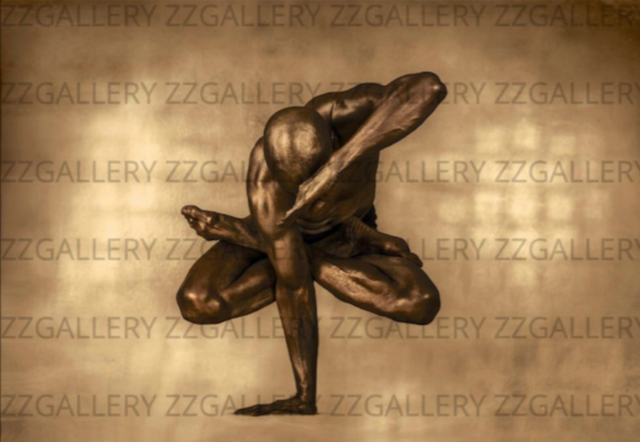 Golden-painted man in lotus pose suspended mid-air – sculptural wall art