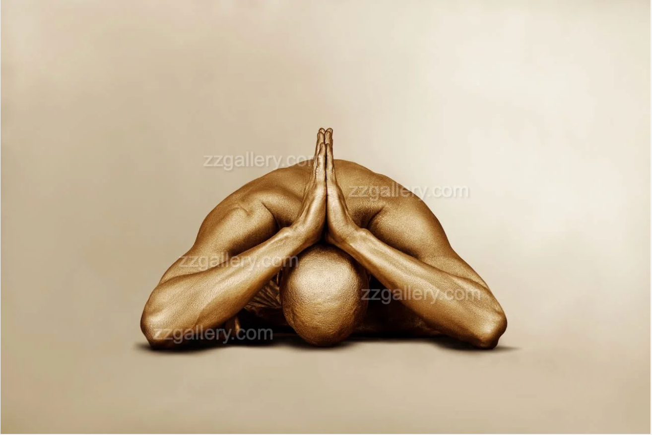 Golden-painted figure in a contemplative pose – fine art photography by Zack Zublena, luxury gold silhouette wall decor for interiors and wellness spaces.