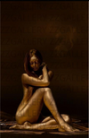 Golden nude female figure in a serene seated position with a dark golden-brown background, fine art by Zack Zublena – sacred feminine photography.