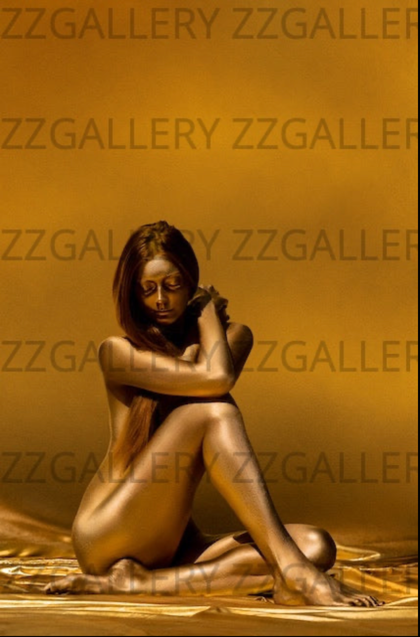 Golden-painted silhouette in a seated pose against a luminous golden background, fine art photography by Zack Zublena – elegant feminine wall art.