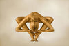 Gold-painted nude woman in powerful yoga star pose, spiritual and sculptural fine art wall decor.