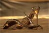 Golden high heels fine art photography – luxury stiletto shoes in gold, glamorous footwear artwork for boutique hotel and interior design