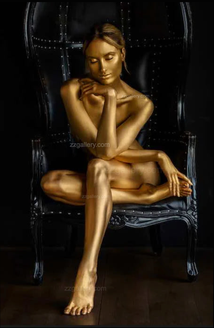 Elegant living room with a tufted brown leather Chesterfield sofa against a dark textured wall, featuring a framed golden fine art painting of a sleeping goddess seated on a black chair