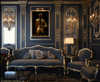 Baroque luxury living room with golden-painted nude female warrior artwork, braided hair and sword, displayed in ornate gold and navy interior design.