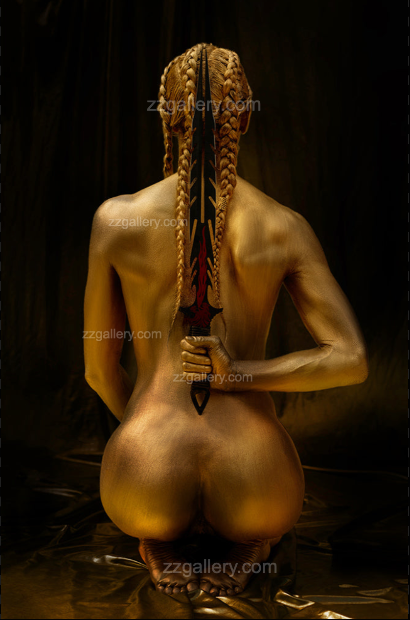 Golden-painted figure kneeling with braided hair and a sword held behind the back, symbolizing strength, resilience, and artistic warrior-inspired fine art photography.