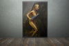 Golden-painted warrior woman holding a dagger, captured in fine art photography with dramatic lighting, symbolizing strength, courage, and divine feminine power.