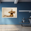Golden painted nude body in advanced yoga hand balance pose, fine art wall decor by Zack Zublena, displayed in a modern gym with blue walls and treadmill.