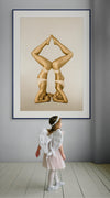 Golden-painted female duo in synchronized headstand yoga pose forming a perfect diamond shape with their bodies, captured in fine art photography. Symbolizes balance, harmony, strength, and divine connection—ideal for yoga studios, wellness centers, and luxury interior design.