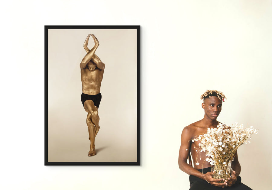 Golden-painted male body in eagle yoga pose with arms crossed above head, luxury fine art wall decor for modern minimalist interiors, wellness studios, and meditation rooms.