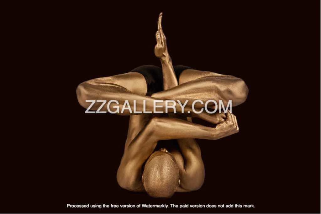 Golden-painted yoga figure in an intricate inverted pose, captured as contemporary fine art wall decor for meditation and modern interiors.