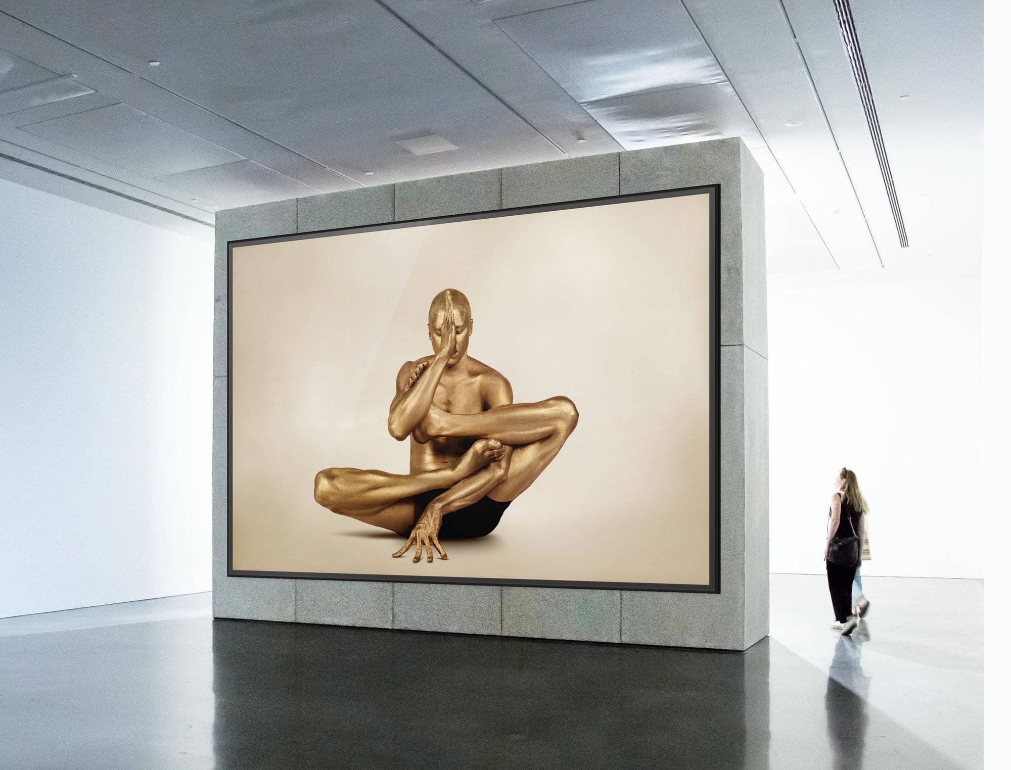 Golden-painted male figure in a sculptural yoga pose with hand to face, captured as fine art photography. Ideal for yoga studios, meditation rooms, luxury interiors, and modern art collections.