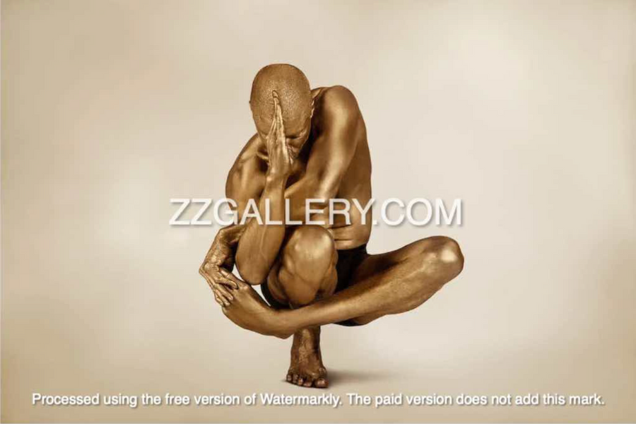 Golden-painted male figure in a surreal yoga pose, balancing in mid-air with one hand covering his face. Conceptual fine art photography symbolizing transcendence and spiritual meditation.