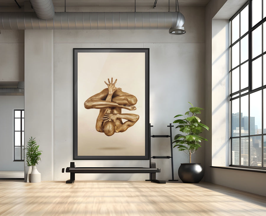 Golden body art photography of a suspended yoga pose, featuring a painted yogi in mid-air balance with arms folded and one hand extended upward. Contemporary fine art wall decor by Zack Zublena, ideal for modern interiors, yoga studios, and wellness spaces.