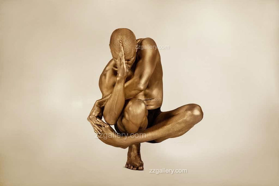 Golden figure in a surreal yoga pose, appearing to balance gracefully in mid-air. Conceptual fine art photography symbolizing transcendence, balance, and meditation."