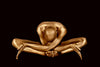 Golden-painted yogi in a forward bend pose on a deep dark background, expressing serenity, balance, and artistic elegance. Fine art wall décor by Zack Zublena.