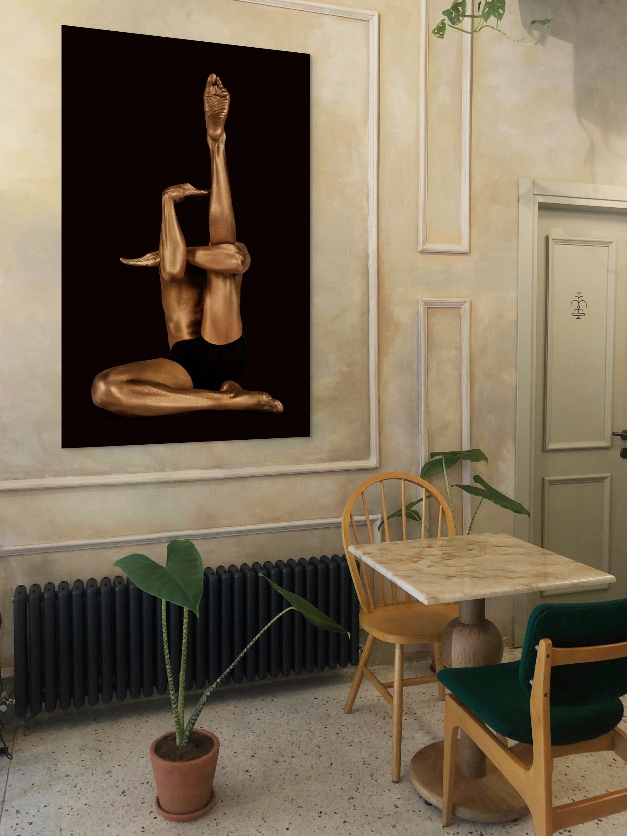 Golden-painted nude figure in an avant-garde yoga pose, legs extended upward, symbolizing meditation, transcendence, and quantum field awareness.