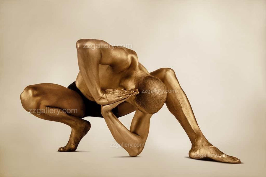 Golden-painted male figure in a deep crouching yoga pose, conceptual fine art photograph symbolizing strength, surrender, and quantum field balance — luxury wall art.