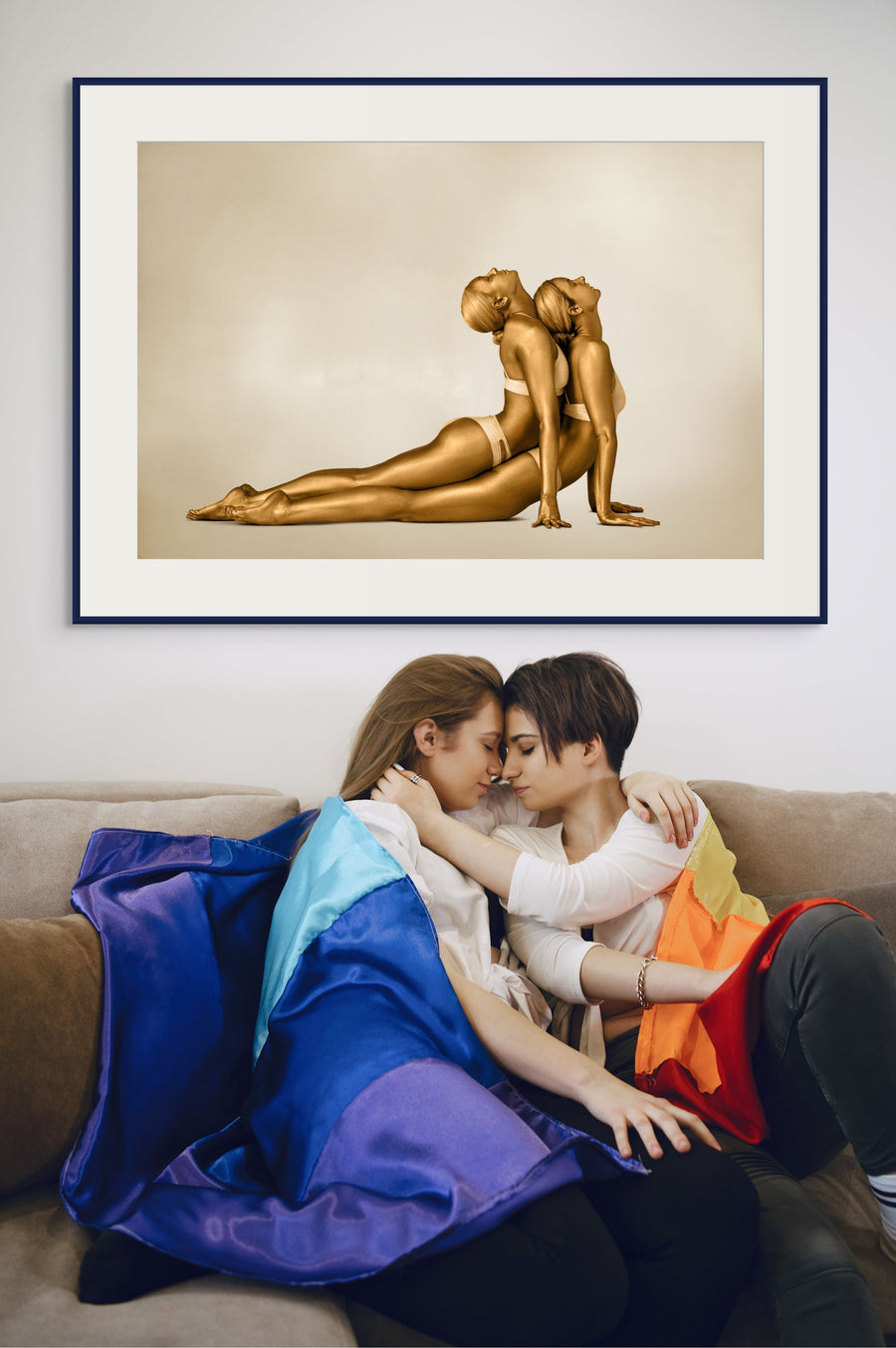 Fine art photograph of two golden-painted women in a mirrored yoga pose, symbolizing unity, balance, and fluidity. Perfect wall art for yoga studios, wellness centers, luxury interiors, and collectors of contemporary gold photography.
