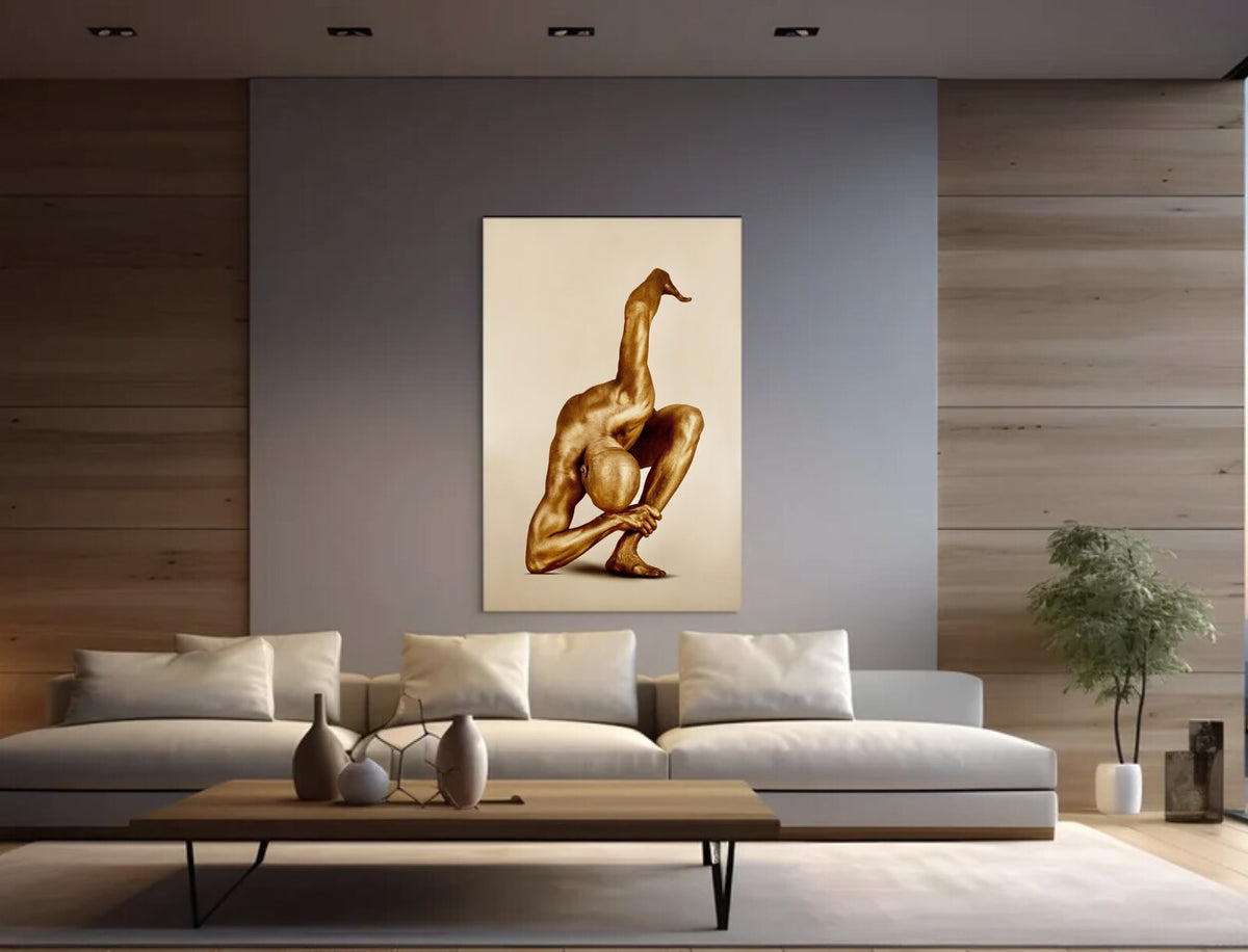 Golden-painted male figure in a dramatic sculptural yoga pose, balancing with one leg raised and arms intertwined, captured as fine art photography. This powerful gold body artwork symbolizes strength, resilience, and modern spiritual expression, making it ideal for luxury interiors, yoga spaces, and contemporary art collectors.
