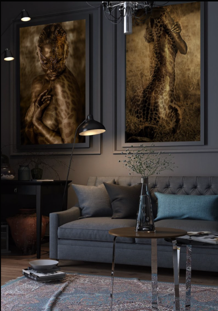 Mockup featuring two golden fusion wall art prints with leopard and figure blends, displayed above a modern grey sofa in a chic interior setting.