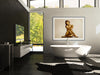 Golden-painted nude woman seated gracefully with crossed legs and arms, exuding elegance and serenity — luxury fine art wall décor for spa, wellness, or interior design.