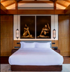 Luxury golden nude yoga diptych wall art in a dark modern bedroom, creating a high-end spa-inspired atmosphere.