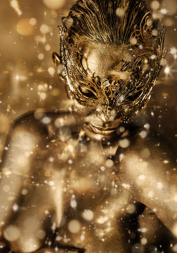 Gold-painted woman wearing an ornate mask surrounded by sparkles, symbolizing divine mystery, spiritual radiance, and sacred feminine energy.