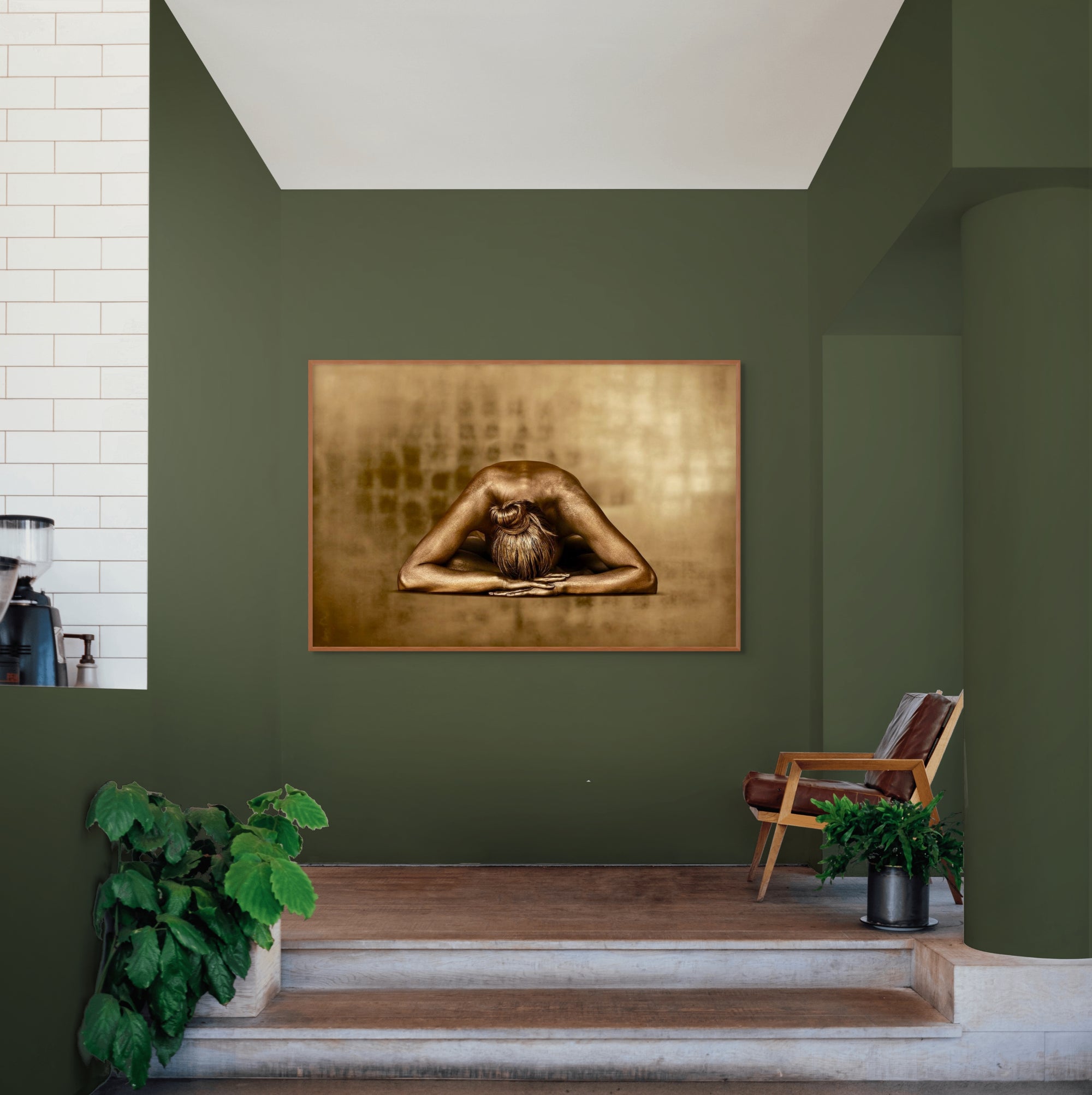 Golden-painted figure resting forward with arms extended, fine art photography by Zack Zublena titled "Royal Rest,