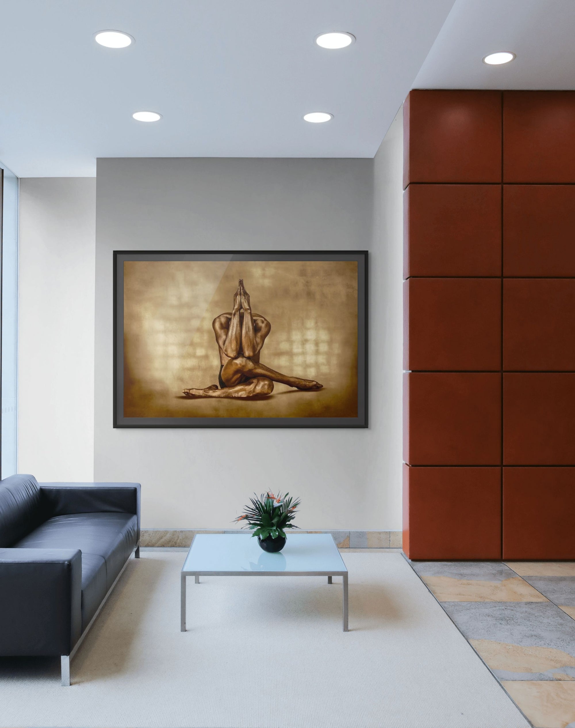 Golden-painted figure in a sculptural yoga pose with hands pressed together, seated gracefully against a warm textured background – fine art photography by Zack Zublena, ideal for wellness interiors, spas, meditation rooms, and modern luxury spaces