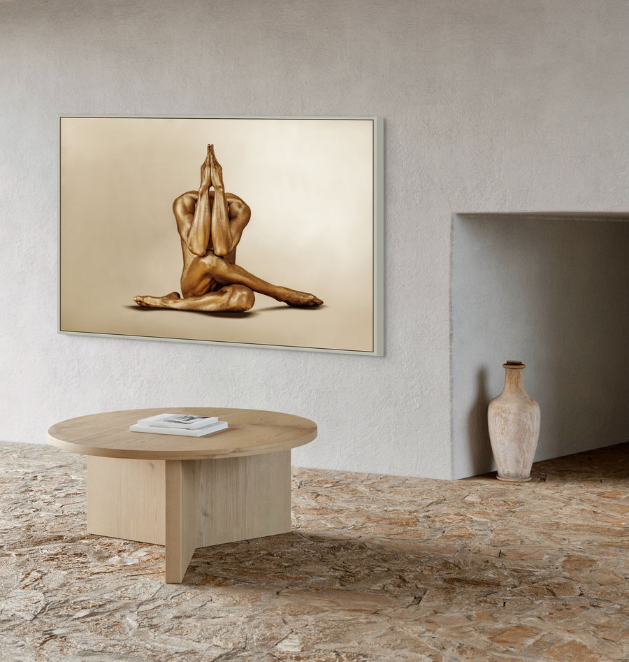 Gold-painted figure in a prayer pose, meditative fine art photography by Zack Zublena